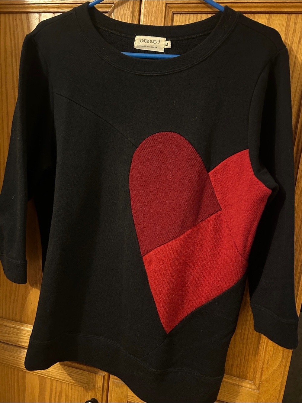 Women’s Black Crewneck Top with Small Red Accent